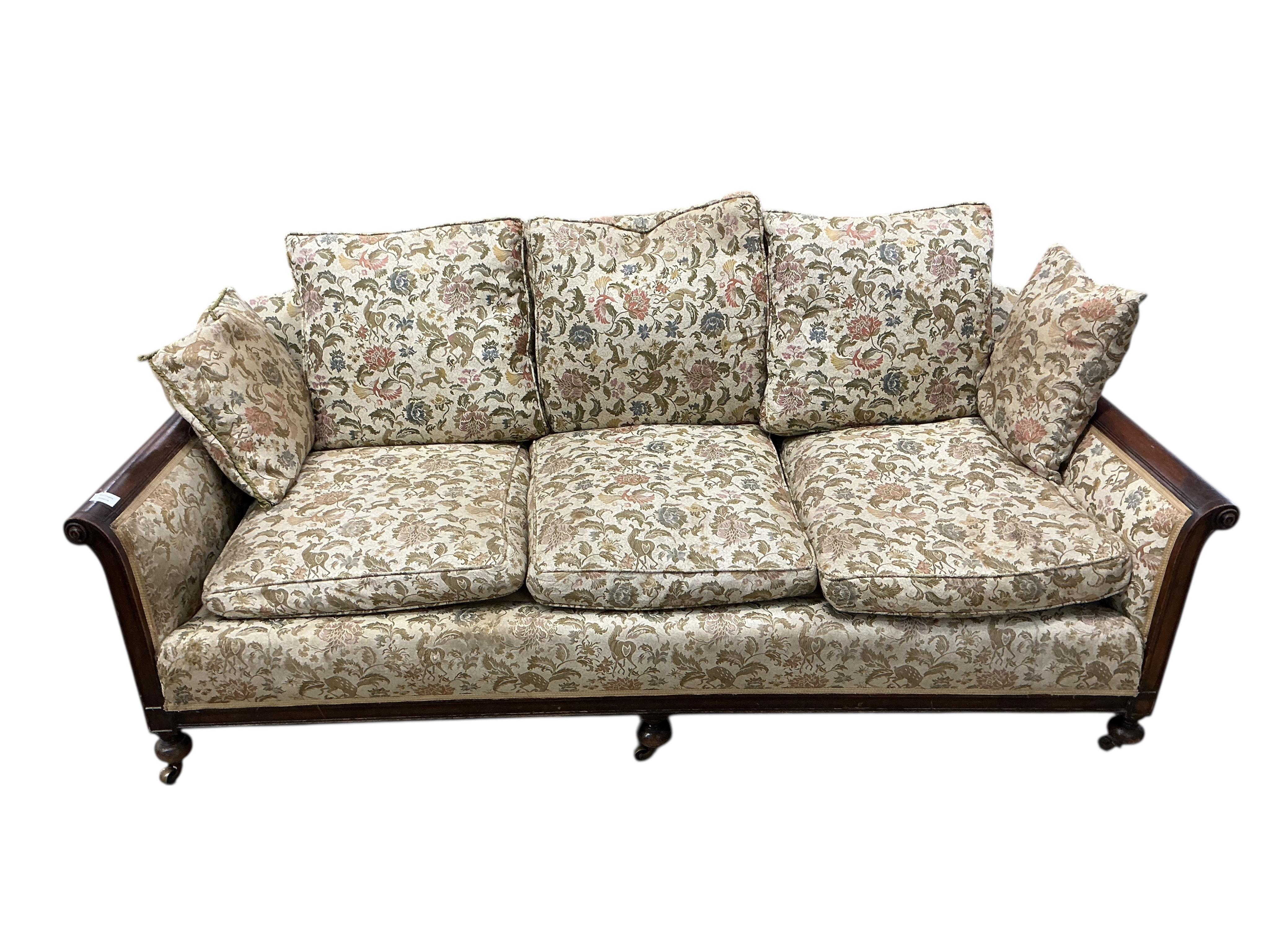 An early 20th century mahogany bergere settee, now upholstered, width 196cm, depth 92cm, height 84cm